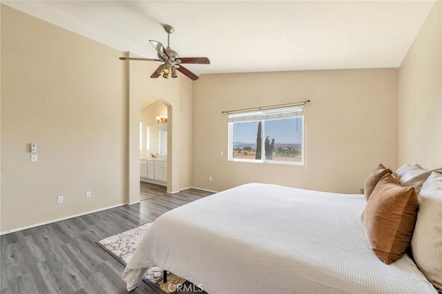 44601 Jamin Cir, Temecula, CA 92592 - bedroom featuring wood finished floors, arched walkways, lofted ceiling, connected bathroom, and ceiling fan