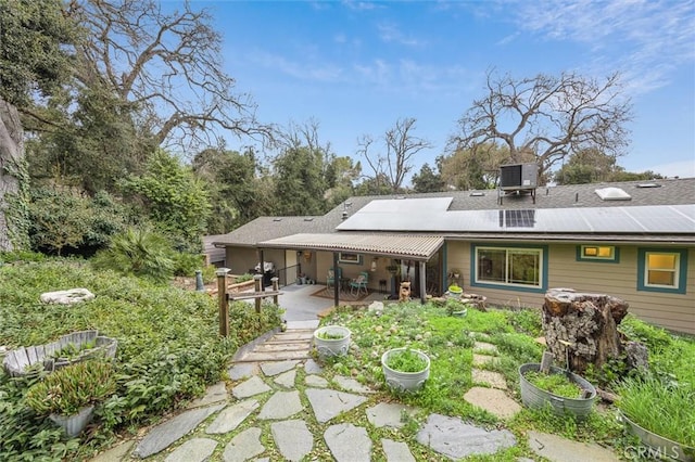 5500 Valentina, Atascadero, CA 93422 - rear view of property with roof mounted solar panels and a patio