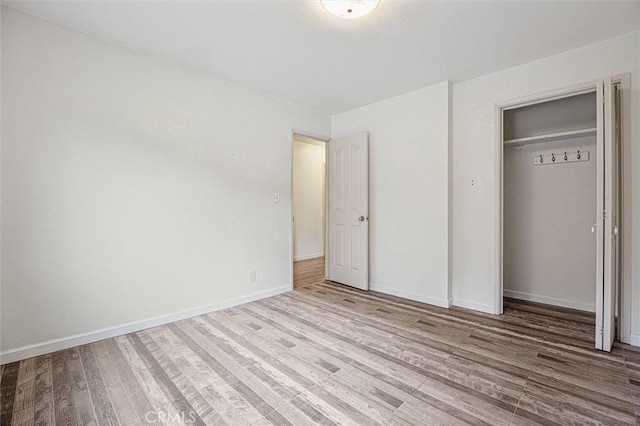 5500 Valentina, Atascadero, CA 93422 - unfurnished bedroom with wood finished floors and a closet