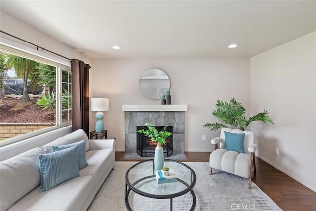 2266 Mcneil Cir, Corona, CA 92882 - living area featuring a tile fireplace, wood finished floors, and recessed lighting