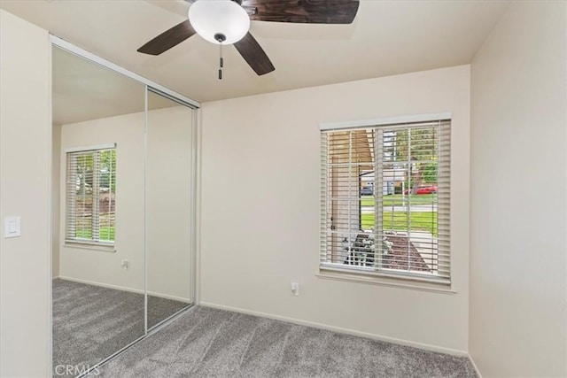 2266 Mcneil Cir, Corona, CA 92882 - unfurnished bedroom with carpet, a closet, and a ceiling fan