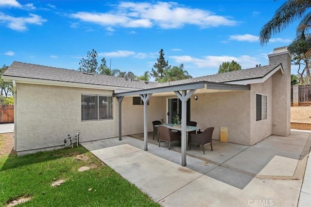 2266 Mcneil Cir, Corona, CA 92882 - rear view of house with stucco siding and a patio area