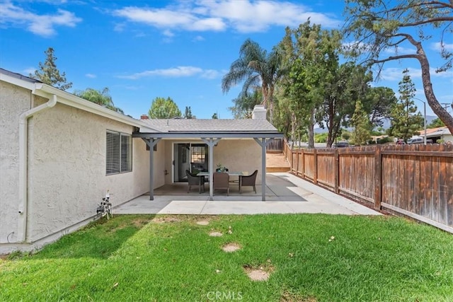 2266 Mcneil Cir, Corona, CA 92882 - rear view of property with a fenced backyard, stucco siding, a patio area, and a chimney