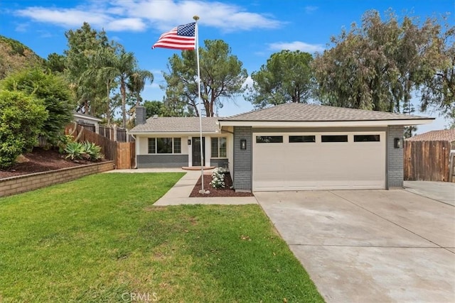 2266 Mcneil Cir, Corona, CA 92882 - view of front of property featuring concrete driveway, brick siding, an attached garage, and a chimney