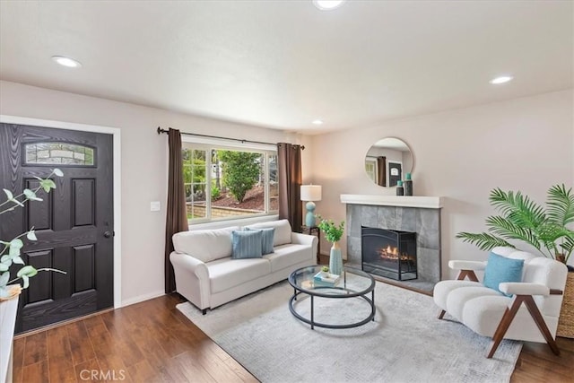 2266 Mcneil Cir, Corona, CA 92882 - living room featuring a tile fireplace, wood finished floors, and recessed lighting