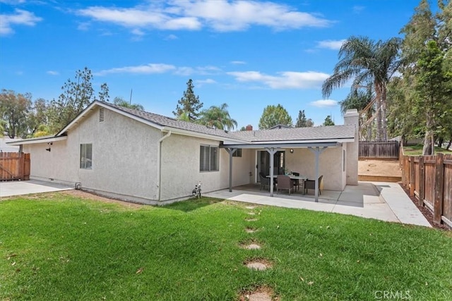 2266 Mcneil Cir, Corona, CA 92882 - back of house with stucco siding, a fenced backyard, a patio, and a chimney