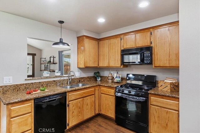 2266 Mcneil Cir, Corona, CA 92882 - kitchen featuring black appliances, dark wood-style flooring, pendant lighting, stone countertops, and recessed lighting