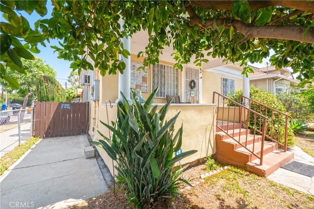 1203 E 33rd St, Los Angeles, CA 90011 - view of front of home featuring stucco siding and a gate