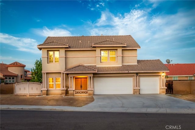 25540 Riley Cir, Menifee, CA 92585 - view of front facade featuring a tiled roof, concrete driveway, a gate, stucco siding, and an attached garage
