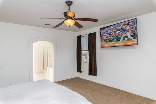 25540 Riley Cir, Menifee, CA 92585 - bedroom featuring arched walkways, carpet flooring, a ceiling fan, and connected bathroom