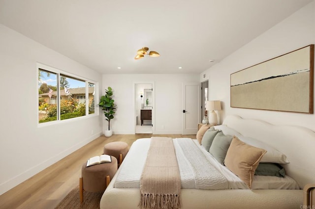 113 Via Breve Unit 23, San Clemente, CA 92672 - bedroom with light wood-style floors, recessed lighting, and ensuite bath