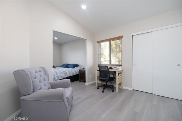 25165 Pebble Creek Way, Moreno Valley, CA 92551 - bedroom with light wood-type flooring, lofted ceiling, a closet, an office area, and recessed lighting