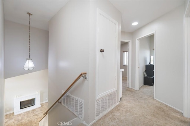 25165 Pebble Creek Way, Moreno Valley, CA 92551 - hallway featuring an upstairs landing and carpet