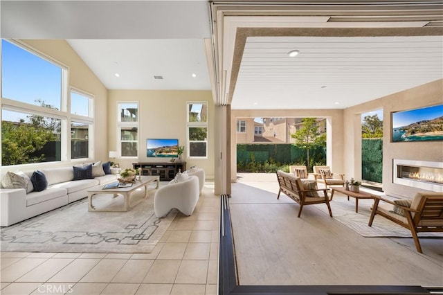 125 Character, Irvine, CA 92618 - living area with light tile patterned floors, a glass covered fireplace, plenty of natural light, and recessed lighting