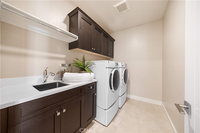 125 Character, Irvine, CA 92618 - washroom with washing machine and dryer, cabinet space, and light tile patterned flooring