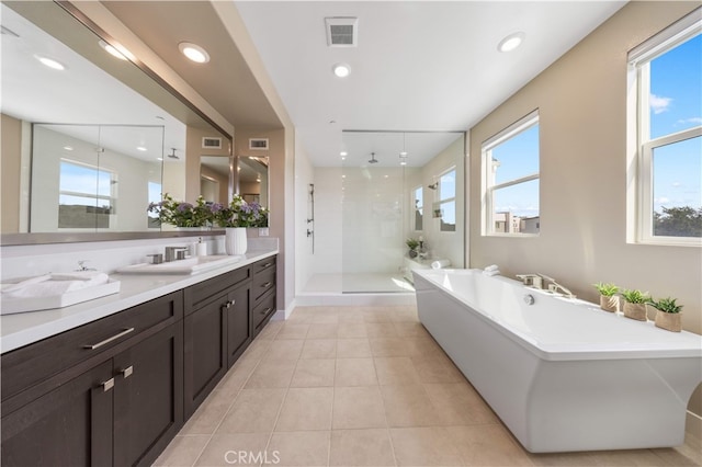 125 Character, Irvine, CA 92618 - bathroom with a shower stall, vanity, a freestanding bath, tile patterned flooring, and recessed lighting