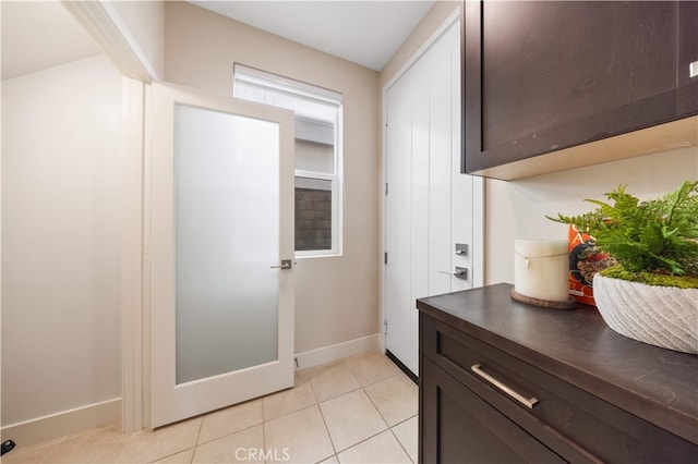 125 Character, Irvine, CA 92618 - hallway featuring light tile patterned flooring and baseboards