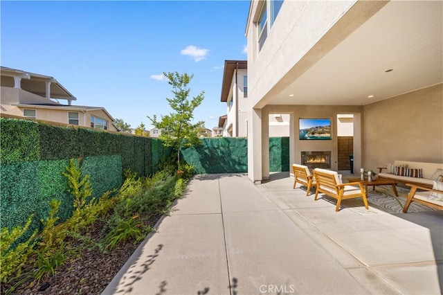 125 Character, Irvine, CA 92618 - fenced backyard featuring a patio and an outdoor living space with a fireplace