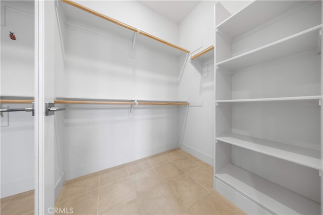 125 Character, Irvine, CA 92618 - walk in closet featuring tile patterned flooring
