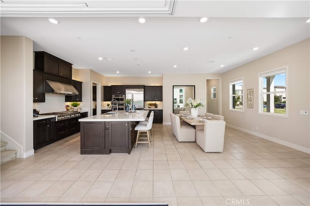 125 Character, Irvine, CA 92618 - kitchen with open floor plan, light countertops, light tile patterned floors, stainless steel appliances, and a breakfast bar area