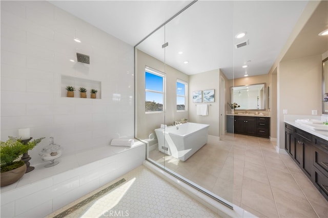 125 Character, Irvine, CA 92618 - bathroom with a soaking tub, two vanities, tile patterned floors, a shower, and recessed lighting