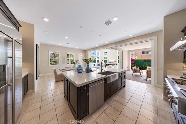125 Character, Irvine, CA 92618 - kitchen with stainless steel appliances, open floor plan, light tile patterned flooring, light countertops, and recessed lighting