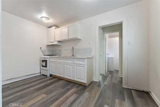 5868 Estrella Ave, Los Angeles, CA 90044 - kitchen with white gas range oven, under cabinet range hood, dark wood-type flooring, and white cabinets