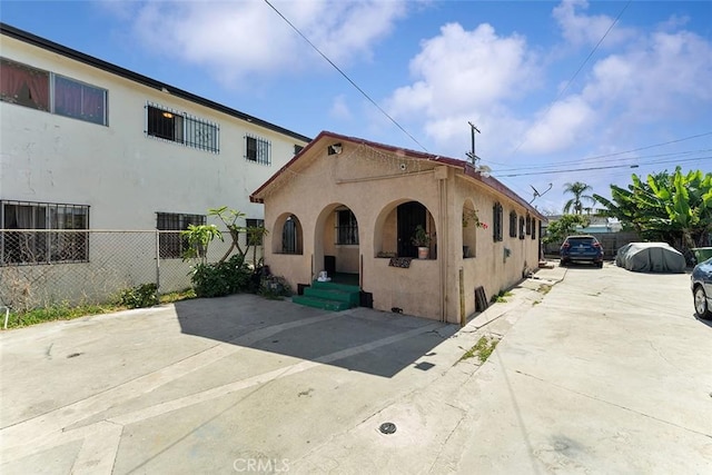 5868 Estrella Ave, Los Angeles, CA 90044 - mediterranean / spanish-style house with stucco siding