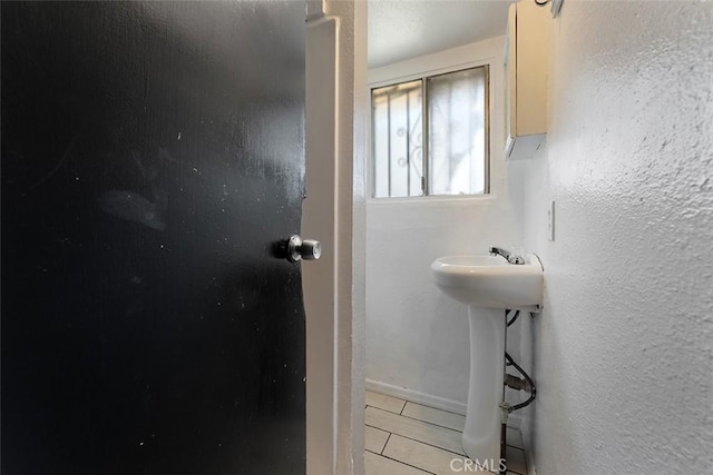 5868 Estrella Ave, Los Angeles, CA 90044 - bathroom featuring tile patterned floors and baseboards