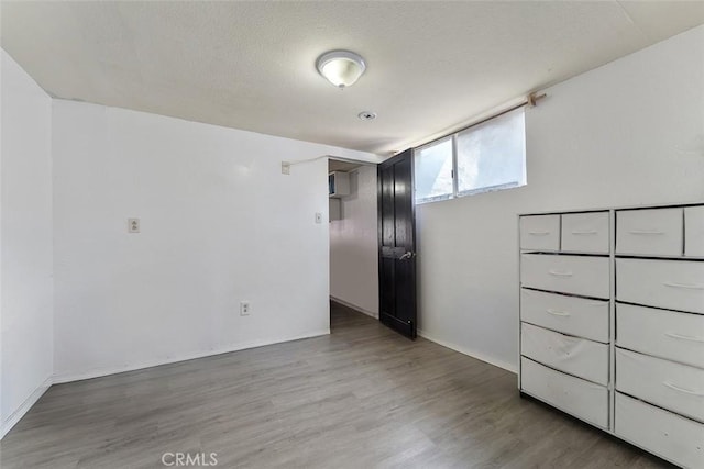 5868 Estrella Ave, Los Angeles, CA 90044 - unfurnished room with light wood-style floors and baseboards