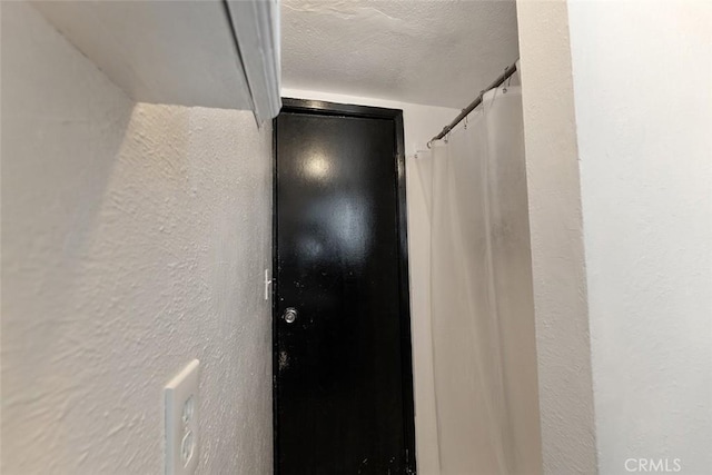 5868 Estrella Ave, Los Angeles, CA 90044 - hallway with a textured wall and a textured ceiling