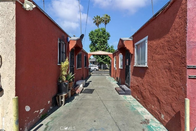 5868 Estrella Ave, Los Angeles, CA 90044 - view of side of property featuring stucco siding and a patio