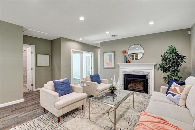 4437 Keever Ave, Long Beach, CA 90807 - living room featuring wood finished floors, recessed lighting, and a glass covered fireplace