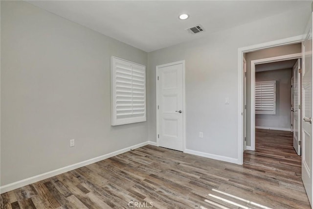4437 Keever Ave, Long Beach, CA 90807 - unfurnished bedroom featuring wood finished floors and recessed lighting