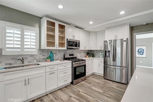 4437 Keever Ave, Long Beach, CA 90807 - kitchen with appliances with stainless steel finishes, light countertops, white cabinetry, and recessed lighting