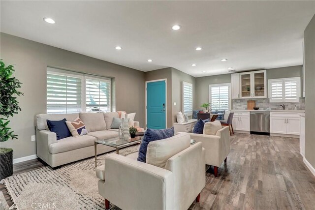 4437 Keever Ave, Long Beach, CA 90807 - living room with light wood finished floors and recessed lighting