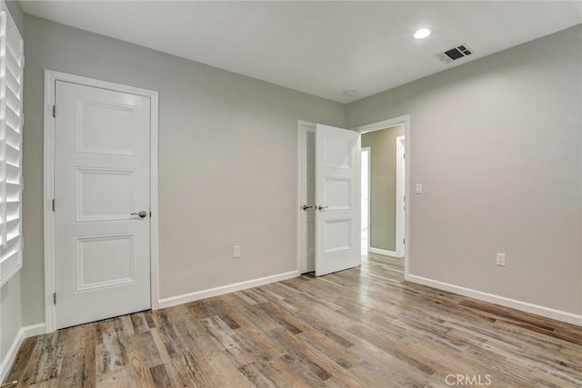 4437 Keever Ave, Long Beach, CA 90807 - spare room with wood finished floors and recessed lighting
