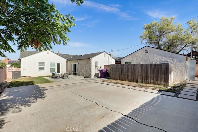 4437 Keever Ave, Long Beach, CA 90807 - back of property featuring stucco siding and a patio