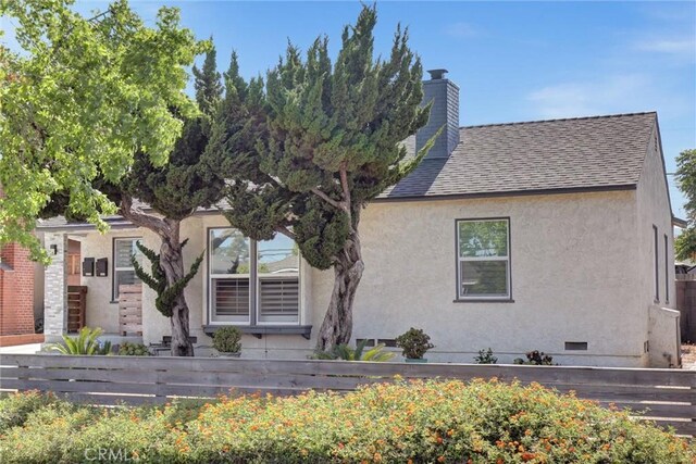4437 Keever Ave, Long Beach, CA 90807 - view of front of home with a chimney, stucco siding, roof with shingles, and crawl space