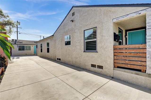4437 Keever Ave, Long Beach, CA 90807 - back of property featuring a patio and stucco siding