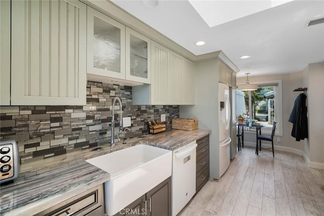24532 Moonfire Dr, Dana Point, CA 92629 - kitchen featuring white appliances, decorative backsplash, light stone countertops, light wood-style flooring, and recessed lighting