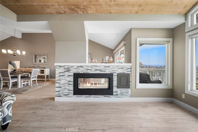 24532 Moonfire Dr, Dana Point, CA 92629 - living room with wood finished floors, a multi sided fireplace, a chandelier, and wood ceiling
