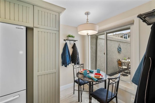 24532 Moonfire Dr, Dana Point, CA 92629 - dining area featuring baseboards and light wood-style flooring
