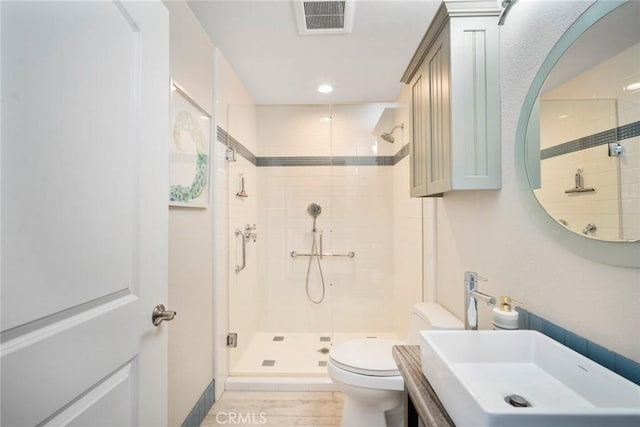 24532 Moonfire Dr, Dana Point, CA 92629 - bathroom with a shower stall, vanity, recessed lighting, and wood finished floors