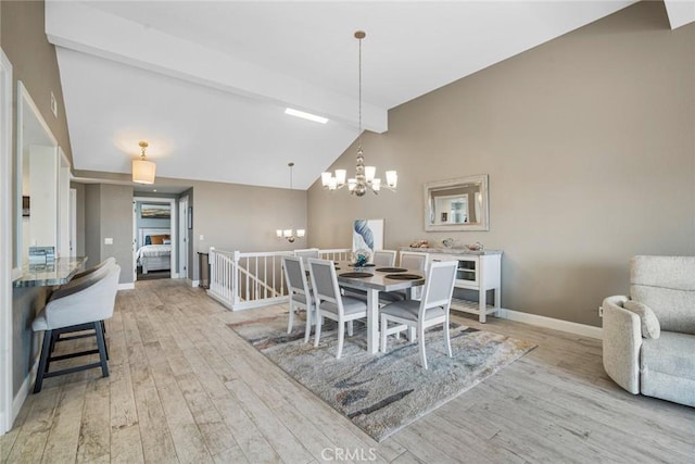 24532 Moonfire Dr, Dana Point, CA 92629 - dining area with a chandelier, light wood-style flooring, beam ceiling, and high vaulted ceiling