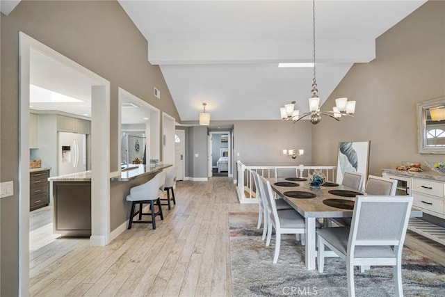 24532 Moonfire Dr, Dana Point, CA 92629 - dining room with a chandelier and light wood-style floors