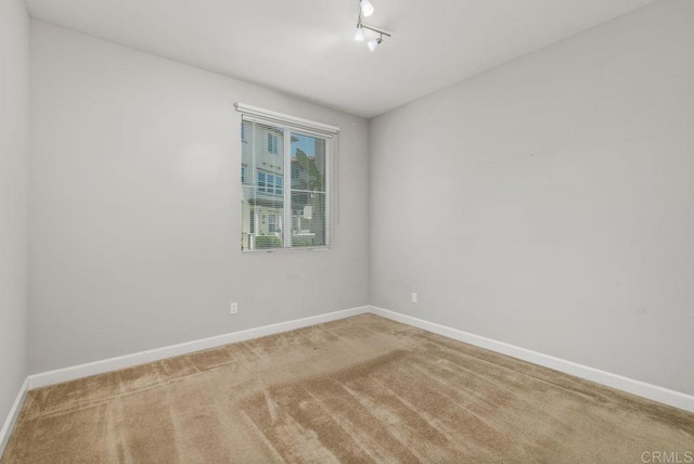 3510 Brody Way, Oceanside, CA 92056 - empty room with carpet and track lighting