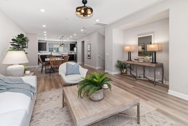 3510 Brody Way, Oceanside, CA 92056 - living area featuring light wood-style flooring and recessed lighting