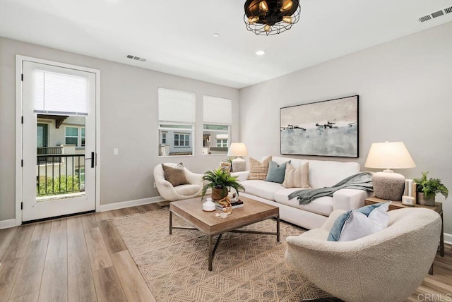 3510 Brody Way, Oceanside, CA 92056 - living area with healthy amount of natural light, wood finished floors, and recessed lighting