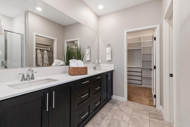 3510 Brody Way, Oceanside, CA 92056 - full bathroom with a walk in closet, double vanity, a shower stall, tile patterned flooring, and recessed lighting